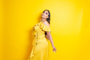 Fototapeta premium sensual fashion and elegant latin woman with long yellow dress
