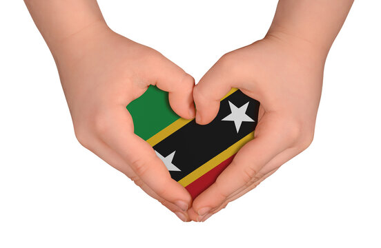 Kid's hands in heart- form. National peace concept on white background. Saint Kitts and Nevis