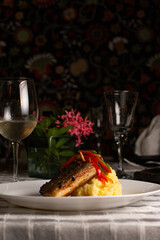 Grilled fish, mashed potatoes, passion fruit sauce, wine