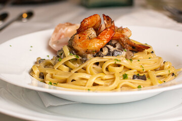 Noodles with seafood. Pasta with shrimp and prawns.