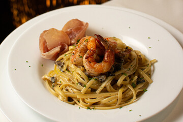 Noodles with seafood. Pasta with shrimp and prawns.