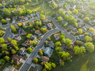 spring sunrise over residential area of Fort Collins in northern Colorado with streets after asphalt crack sealing, aerial view - obrazy, fototapety, plakaty