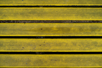wooden boards painted yellow. background texture. 