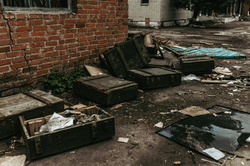 Boxes with weapons left by Russian troops in a Ukrainian village