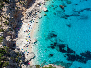 Cala Goloritze beach with crystal clear waters seen from the drone, Sardinia, Italy