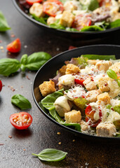 Vegetarian ceasar salad with meat free chicken pieces cherry tomatoes croutons and lettuce