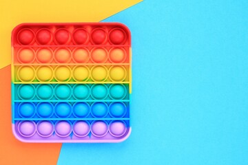 Pop it silicone rubber push antistress fidget toy. Sensory relief game for autism. Trendy popular hype poppit. Rainbow shape. Therapy, education, motor skills for childs and adults. Top view, flat lay
