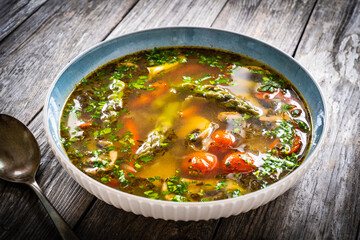 Asparagus soup on wooden table	