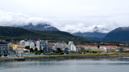 Fototapeta na wymiar City of Ushuaia, Argentina, at the base of the mountains