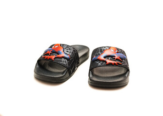 Obraz premium Pair of adilette shower slides sandal style with an open toe and print design of Spiderman from Adidas isolated on white background