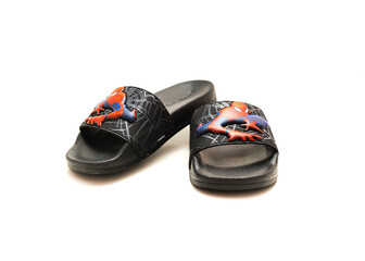 Obraz premium Pair of adilette shower slides sandal style with an open toe and print design of Spiderman from Adidas isolated on white background