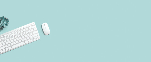 Computer keyboard and mouse from above - overhead view