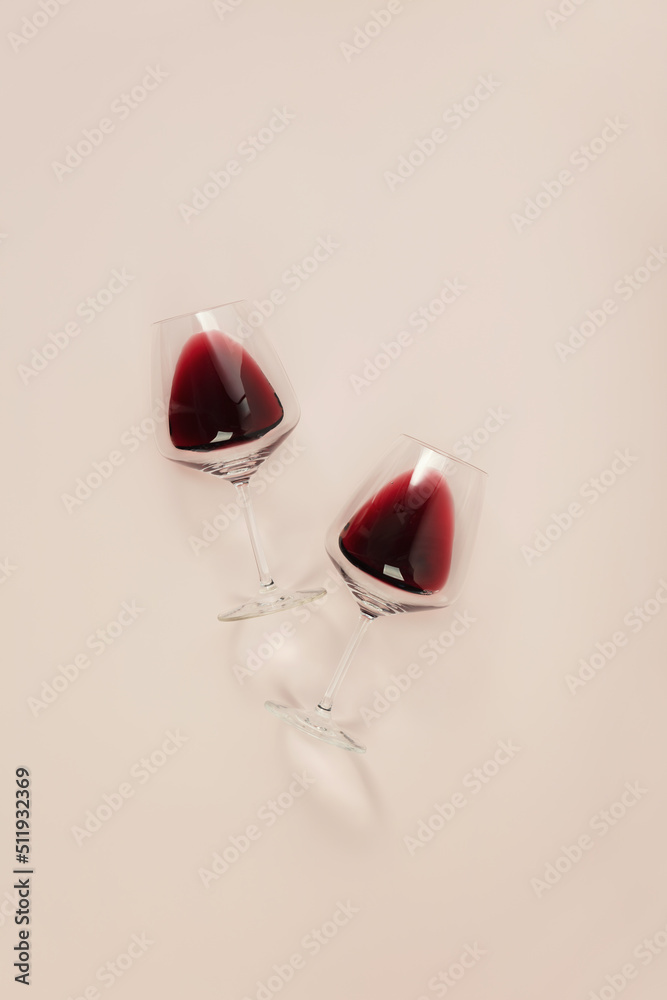 Canvas Prints Flat-lay of red wine in glasses on pink background