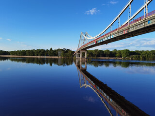 Kyiv, Ukraine - May 24, 2022: Landscape of the pedestrian bridge in Kiev. Summer time