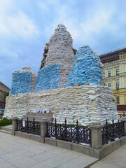 Kyiv, Ukraine, May 27, 2022: Covered monument to Princess Olga, St. Andrew the Apostle, educators...