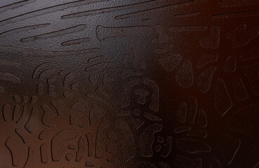 Brown stone texture with hieroglyphs