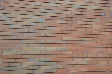 Brick wall. Background. Decorative facing brick. Modern finishing building materials.