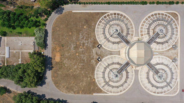 Aerial drone top view photo of round waste separators in sewage treatment plant of Psitaleia, Piraeus, Attica, Greece