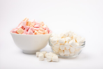 Marshmallow white and strawberry in a ceramic plate isolated on a white background. Fruit marshmallow. Sweets and snacks for a snack.