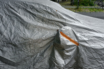 car was covered with auto tarpaulin
