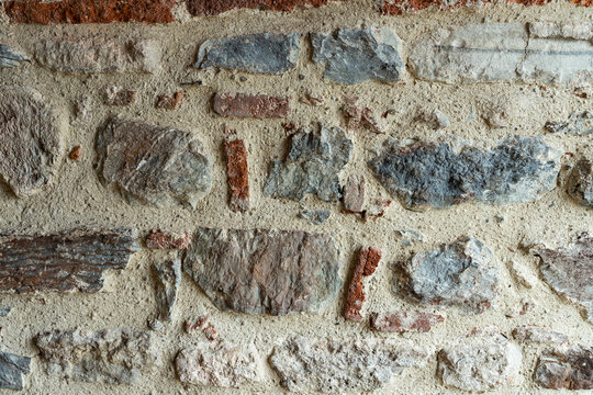 Ancient masonry. An old stone wall. Ancient texture. Close-up photos of high quality