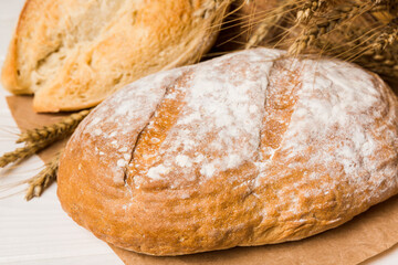 Homemade natural breads. Different kinds of fresh bread as background, perspective view with copy space