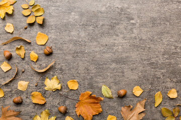 Autumn composition. Pattern made of dried leaves and other design accessories on table. Flat lay, top view