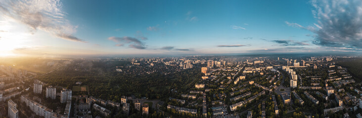 Fototapeta na wymiar Sunny morning wide panorama in city residential district. Aerial colorful view above buildings and streets, Pavlovo Pole, Kharkiv Ukraine
