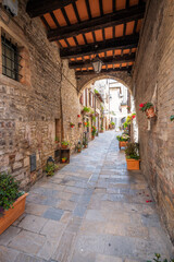 View of an old city centre street of Gubbio (Umbria Region, central Italy). Is world famous as one of the city were lived St. Francis (Christian Italy’s Saint Patron).