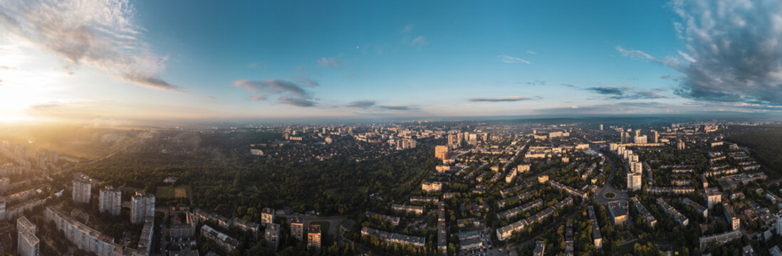 Sunny morning wide panorama in city residential district. Aerial colorful view above buildings and streets, Pavlovo Pole, Kharkiv Ukraine © Kathrine Andi