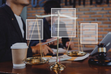 Justice and law concept.Male judge in a courtroom with the gavel, working with, computer and docking keyboard, eyeglasses, on table in morning light