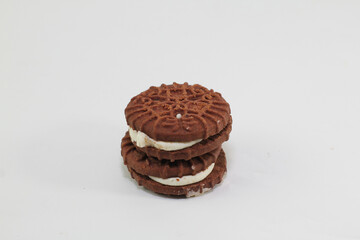 Chocolate biscuits covered with sugar cream, photo on a white background