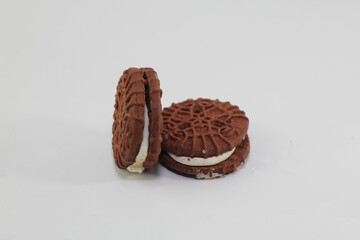 Chocolate biscuits covered with sugar cream, photo on a white background