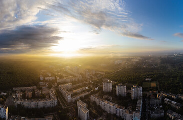 Aerial panoramic sunrise morning city view on residential district with green park and scenic cloudy sky. Kharkiv, Ukraine