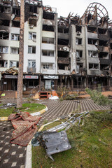 Fototapeta premium Cities of Ukraine after the Russian occupation. Destroyed buildings on the streets of Irpen. Broken, shelled windows. Buildings after being hit by missiles.