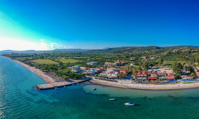 Naklejka na ściany i meble Panoramic aerial view over Gialova seaside city in Navarino bay. It is one of the best touristic places located in Messenia, Greece