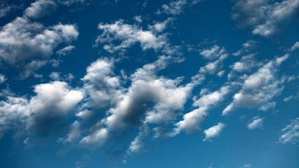 White clouds in the blue sky.