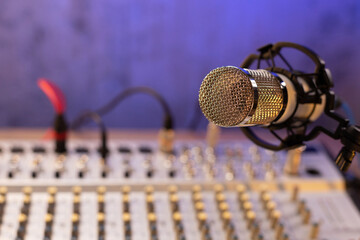 Microphone and sound mixer on desk table. Music audio concept in sound record studio