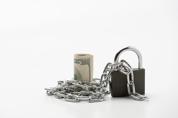 Currency roll locked with chain and padlock on the white background