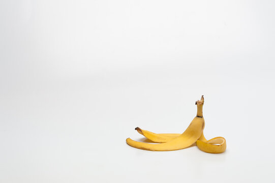 banana peel lying on a white floor