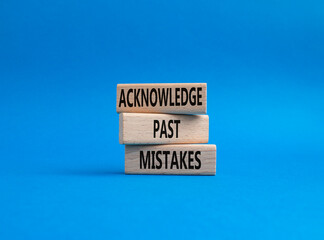 Acknowledge Past Mistakes symbol. Wooden blocks with words Acknowledge Past Mistakes. Beautiful blue background. Business and Acknowledge Past Mistakes. Copy space.