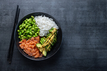 Buddha or poke bowl served on dark