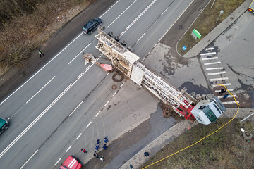 Aerial view of road accident with overturned truck blocking traffic