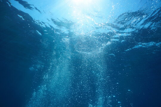 Underwater air bubbles in the sea rising to water surface, natural scene, Mediterranean