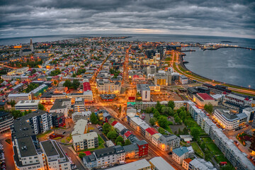 Obraz premium Aerial View of the rapidly growing Urban Center of Reykjavik, Iceland at Night during Summer