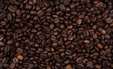 Close-up of roasted brown coffee beans background
