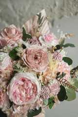Beautiful box with hydrangeas and peonies. Soft pink roses and eucalyptus. Interior composition of flowers.