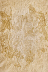 Abstract paper background - in the form of rough with spots coated paper sheet, closeup