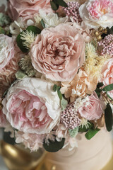 Beautiful box with hydrangeas and peonies. Soft pink roses and eucalyptus. Interior composition of flowers.