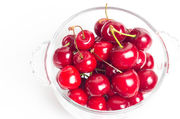Bunch of cherries on transparent plate white background
